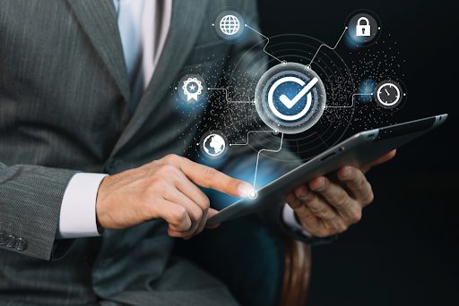 Man holding tablet completing a checklist