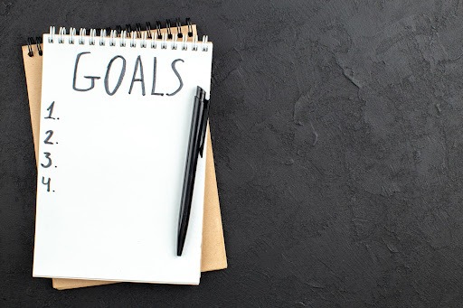 setting goals with a notepad