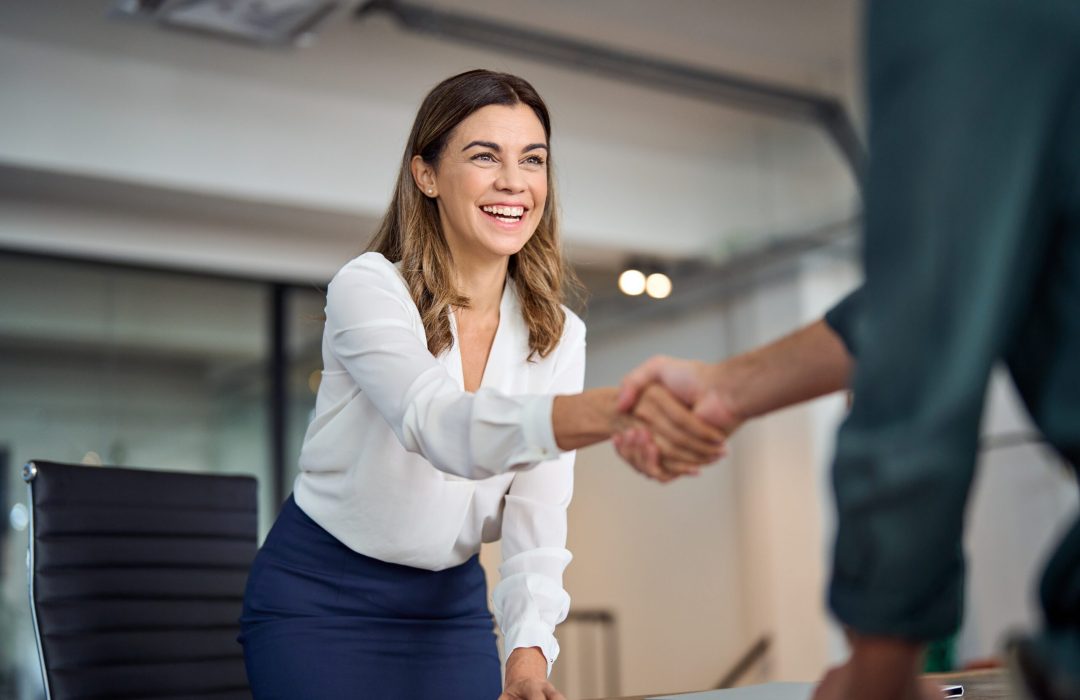 Happy,Mid,Aged,Business,Woman,Manager,Handshaking,Greeting,Client,In two business people shaking hands