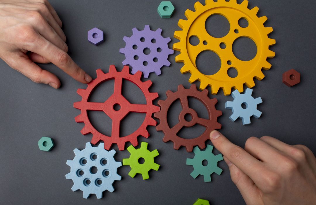 business-processes-with-various-mechanism-pieces-min concept for agile development environment, showing many different cogs and mechanisms working together
