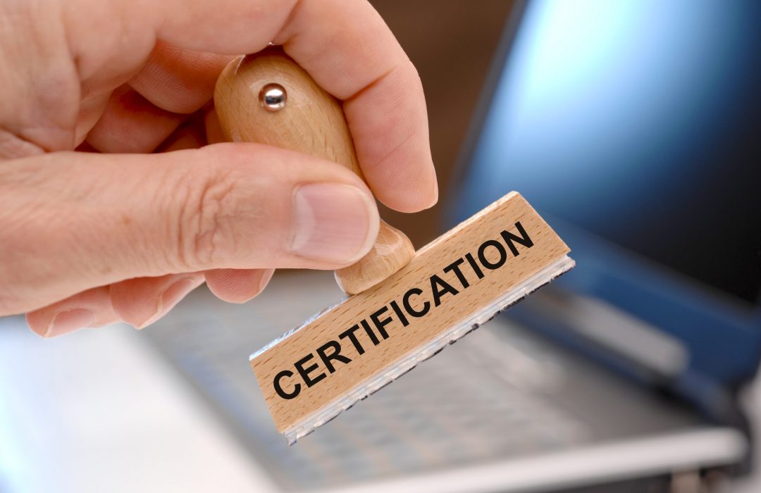 Person stamping a document to show certification