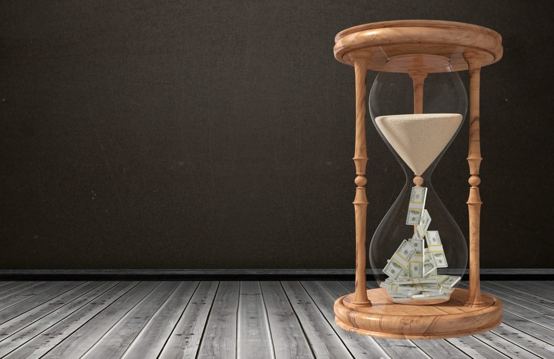hour glass with sand and money hour glass that's losing sand but the sand turns into money