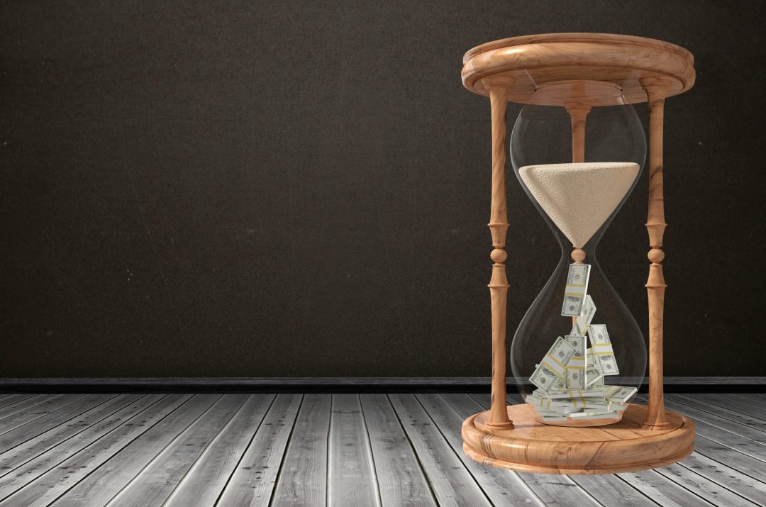 hour glass with sand and money hour glass that's losing sand but the sand turns into money