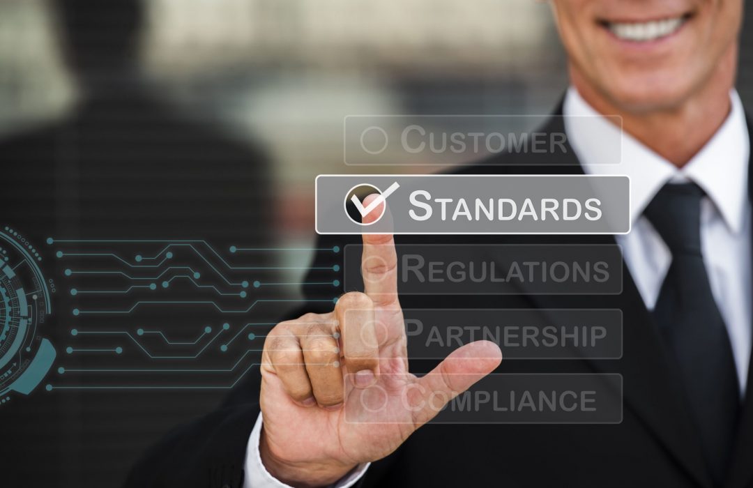 standard-quality-control-collage-min man checking off business standards for compliance
